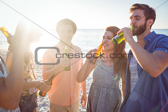 Happy hipsters drinking beer