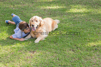 Little boy with his dog in the park