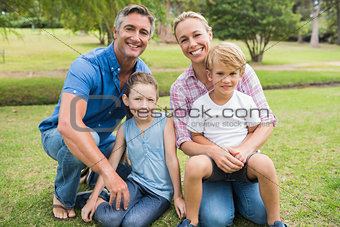 Happy family smiling at the camera