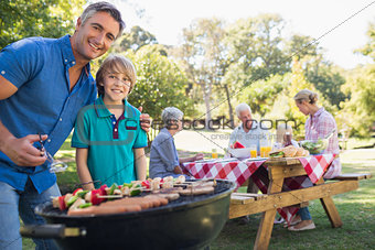 Happy family having picnic in the park