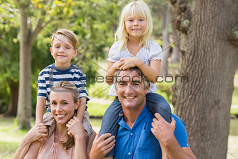 Happy family playing in the park together