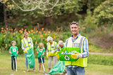 Happy family collecting rubbish