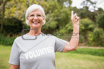 Happy volunteer grandmother with thumbs up