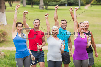 Happy athletic group holding up their fist