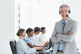 Businessman with executives using computers