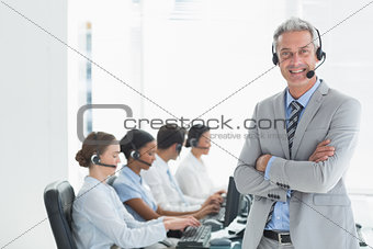 Businessman with executives using computers