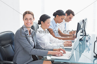 Business people using laptop