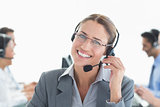 Smiling businessman with headsets looking at camera