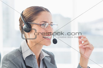 Businesswoman with headset in call centre