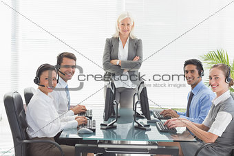 Smiling business people looking at camera