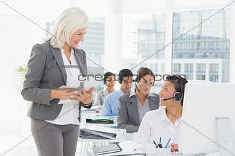 Businesswoman speaking with her colleagues
