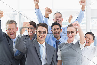 Business people cheering in office