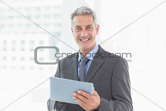 happy businessman using tablet pc