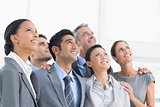 Business people looking up in office
