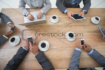 Business people in meeting with new technologies