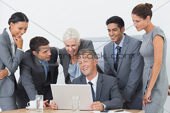 Business people using laptop