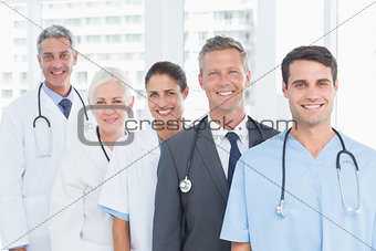 Portrait of confident doctors in row