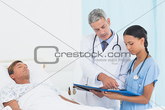 Doctor explaining report to patient