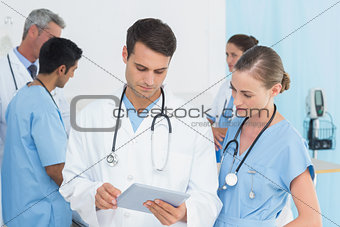 Report reading with colleagues and patient behind