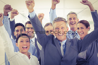 Business people cheering in office