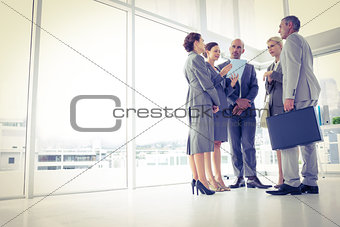Business team standing and speaking
