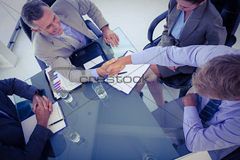 Business team shaking hands at meeting