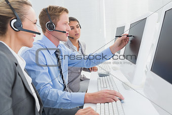 Businessman showing his screen to the team