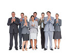 Smiling business team applauding at camera