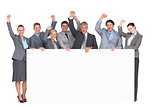 Excited business team holding poster