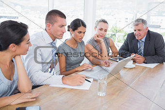 Concentrated business team during meeting