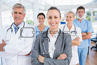 Smiling team of doctors looking at camera