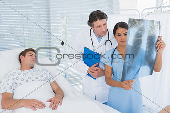Doctors examining patients xray