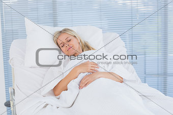 Happy patient lying on her bed