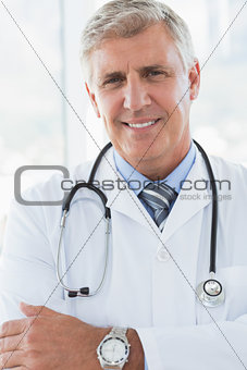 Happy doctor looking at camera