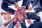 Business team standing hands together