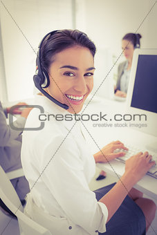 Smiling businesswoman wearing headset
