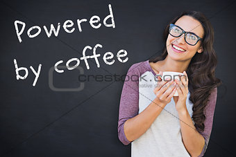 Composite image of brunette with mug