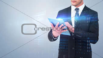 Composite image of unsmiling businessman using tablet pc