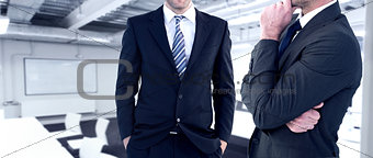 Composite image of frowning businessman thinking