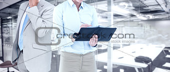 Composite image of businesswoman writing in her diary