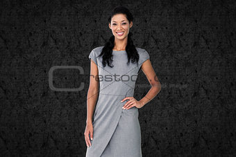Composite image of businesswoman smiling