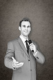 Composite image of businessman giving speech