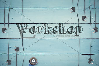 Workshop against plugs on wooden background