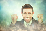 Composite image of businessman smiling and cheering