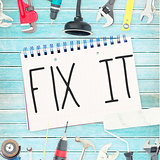 Fix it against tools and notepad on wooden background