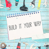 Build it your way against tools and notepad on wooden background