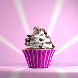 Delicious cupcake with chocolate hearts on a whipped cream.