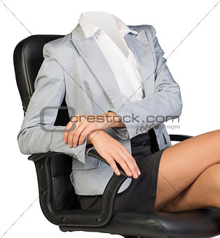 Half-turned woman body sitting in chair