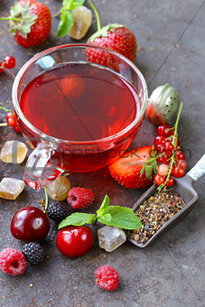 berry tea with fresh currants, raspberries and strawberries