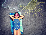 Happy little girl in summer vacation